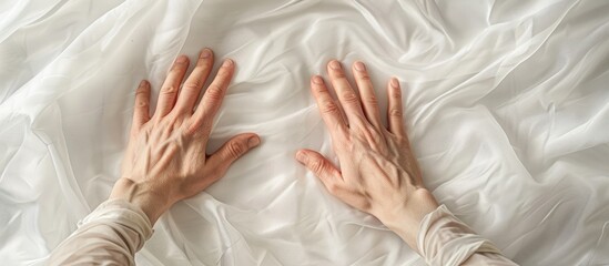 Hands of both genders displayed on a white textile backdrop with room for additional images