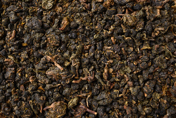 Dried Oolong tea leaves texture background, Top view
