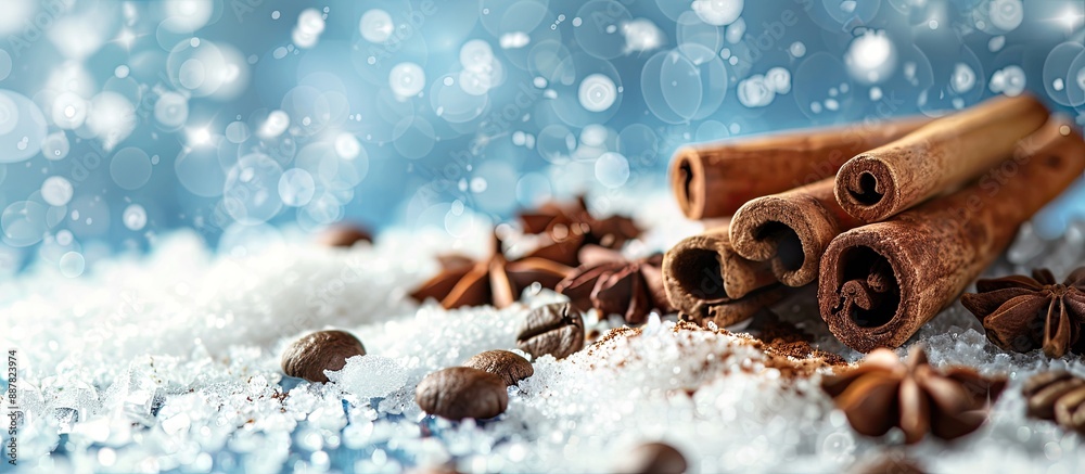 Poster Coffee beans and cinnamon on snowy surface with copy space image