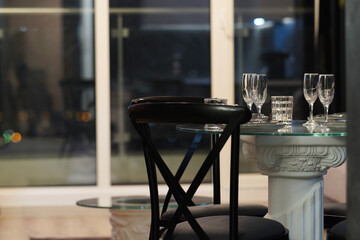 Glass table Dining table setting in a luxury apartment hotel room close up 