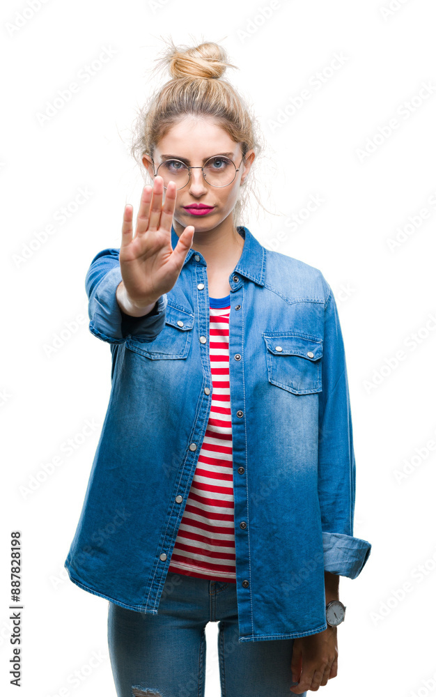 Canvas Prints Young beautiful blonde woman wearing glasses over isolated background doing stop sing with palm of the hand. Warning expression with negative and serious gesture on the face.