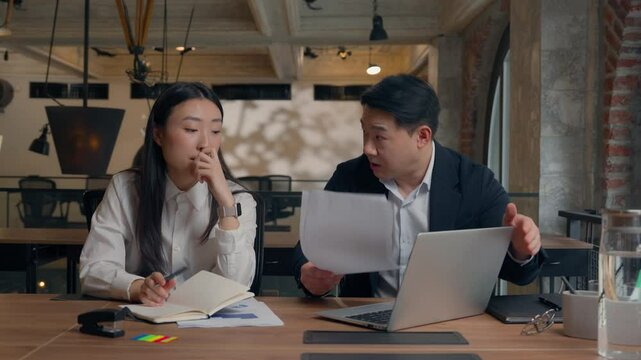 Asian woman Korean girl office intern businesswoman mistake paperwork laptop incorrect data documents bad work Chinese man Japanese business male boss leader angry talk shouting dissatisfied go away