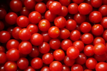 small orange cherry tomatoes in water,organic green food,home cooking,fruit and vegetable in a pan