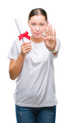 Young caucasian woman holding degree over isolated background with open hand doing stop sign with serious and confident expression, defense gesture