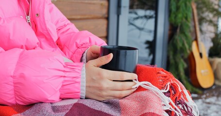 Experience peace and tranquility of winter with hot beverage outdoors, surrounded by cozy and relaxing vibes. Its perfect way to unwind and rejuvenate in serene setting. Relaxation in rustic