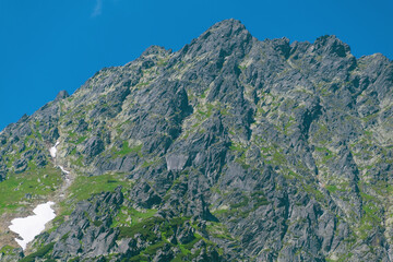 High rock against the blue sky.
