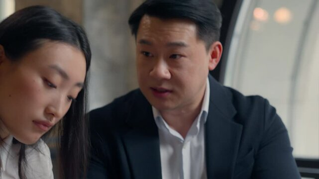 Asian woman Korean girl office manager intern businesswoman mistake paperwork laptop incorrect data documents bad work result Chinese man Japanese business male boss leader angry shouting dissatisfied