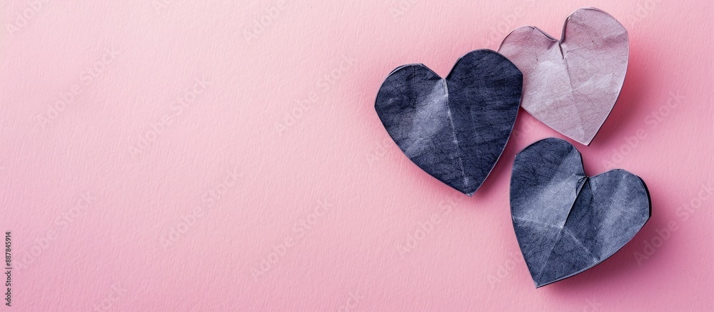 Poster a high quality photo of two paper hearts on a pastel pink background symbolizing a love relationship