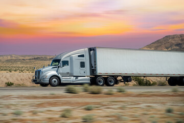 Obraz premium Semi Trucks on road, USA. Trucking in Nevada, USA
