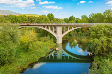 Fototapeta premium Bridge and its reflection in the water. Besalu, Girona, Catalonia, Spain. Famous landmark.