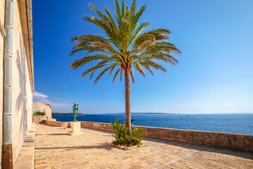 Obraz premium Town of Rab scenic stone street and sea coastline view