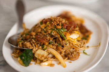 a plate of stir-fried rice, possibly from an Asian cuisine