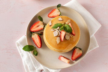Homemade pancakes with strawberries and almonds a delightful, nutritious meal for a special treat