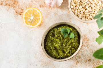 Fresh homemade pesto sauce in a bowl. Italian cuisine. Recipe.