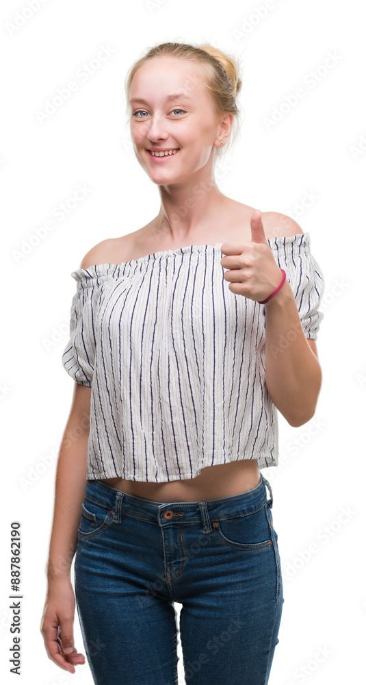 Sticker blonde teenager woman wearing a bun happy with big smile doing ok sign, thumb up with fingers, excel