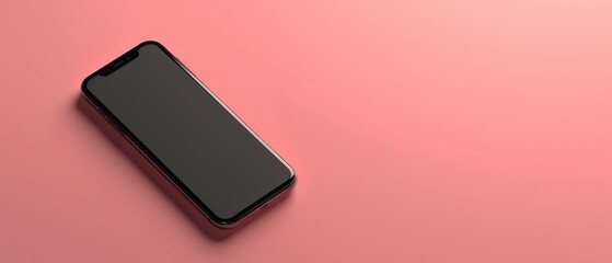 A phone is laying on a pink background