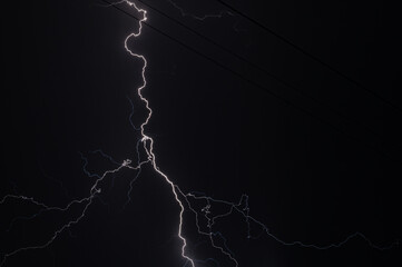 Lightning in the night sky. Thunderstorm and lightning in the night sky. Lightning on a pure black...