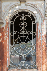 Detail from an ornate shabby style window of a historical building