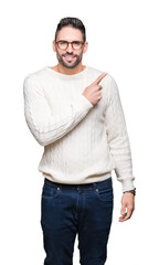 Fototapeta premium Young handsome man wearing glasses over isolated background Pointing with hand finger to the side showing advertisement, serious and calm face