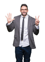 Young handsome business man over isolated background showing and pointing up with fingers number seven while smiling confident and happy.
