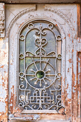 Detail from an ornate shabby style window of a historical building