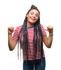 Young braided hair african american girl over isolated background looking confident with smile on...