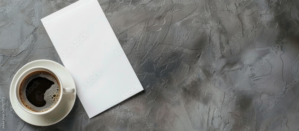 Poster Flat lay mock up featuring blank paper sheets for a brochure and a cup of coffee on a grey background with copy space image