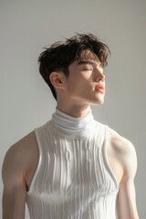 Korean fashion male model, with a handsome face and Dandy cut hair. 