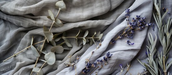 Obraz premium Mockup of a card with grey linen fabric adorned by dried lavender and eucalyptus flowers offering a pleasant copy space image