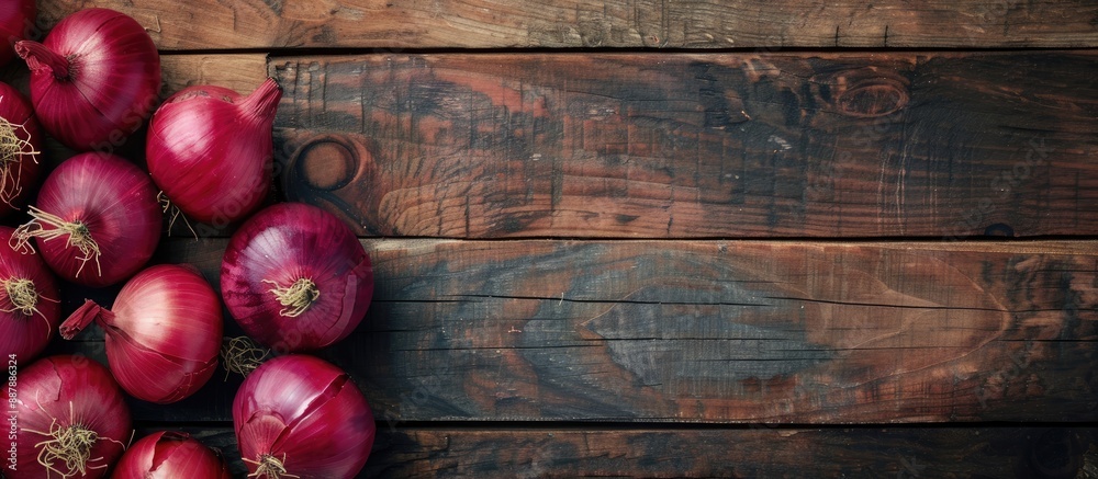 Poster red onions arranged beautifully on a wooden surface providing ample copy space image for your conten
