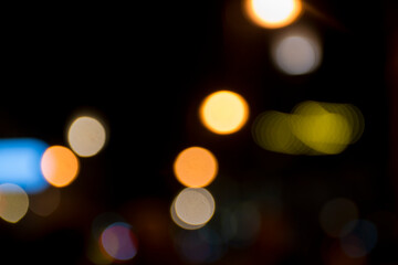 Abstract circular bokeh background of city night light, defocused