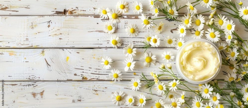 Poster white wooden background with shea butter and chamomile ideal for a copy space image