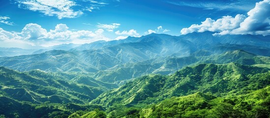 Scenic view of lush green mountains against a vivid blue sky providing a serene backdrop for any copy space image