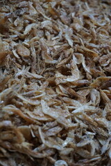 Close up shot of dried shrimp caught from sea, Salted dried shrimp displayed in a fish market in Asia, Dried small shrimp in a seafood market for sale