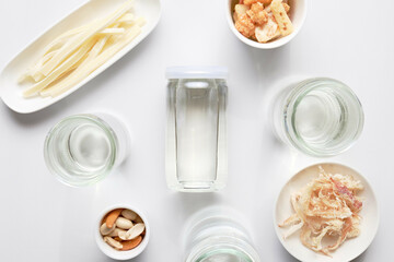 Cup Sake and Snacks on White Background