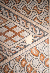 Close-up on medieval floor mosaic in ruins