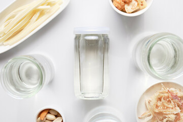 Cup Sake and Snacks on White Background