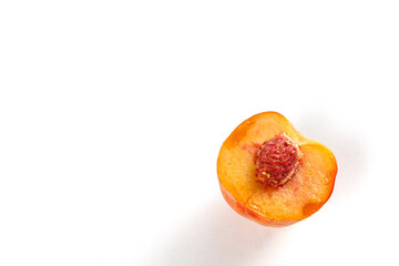 Juicy peach displayed on white background.