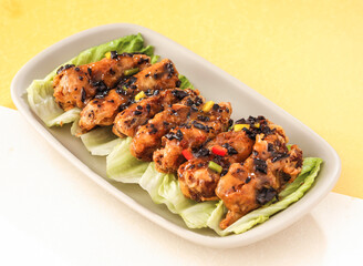Roasted Chicken wings Bones with Olive Sauce served in dish isolated on background side view of hong kong food