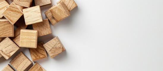 Natural wooden cubes on a white backdrop with copy space image