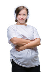 Young adult woman with down syndrome wearing headphones over isolated background happy face smiling with crossed arms looking at the camera. Positive person.