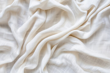 Fototapeta premium Elegant, draped white fabric texture with soft folds and gentle waves. Perfect for backgrounds, textile design, and pattern inspiration.