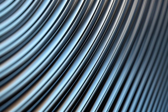 Close-up image of smooth, curved metallic pipes forming an abstract pattern with a shiny, reflective surface in shades of silver.