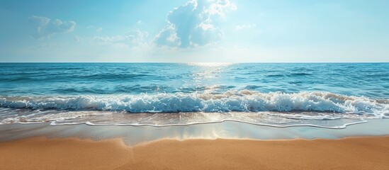 Beach with golden sand and the sea offering a scenic view with copy space image