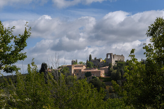 hilltop village in tuscany with a cloudy sky