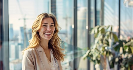 Fototapeta premium A smiling, happy businesswoman radiates warmth and positivity in the modern office environment, surrounded by her team.