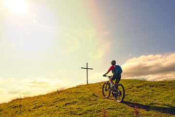 Naklejka premium nice active senior woman riding her electric mountain bike at Mount Huendle in Oberstaufen, Allgaeu Alps , Bavaria, Germany