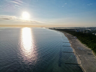 The photo showcases the charming town of Kołobrzeg, located on the shores of the Baltic Sea....