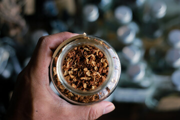 selective focus, good quality Dried Mammea siamensis in a glass jar in a herbal tea shop