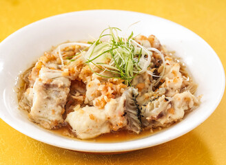 Steamed Dragon Pork with Gold and Silver Garlic paste served in dish isolated on background side view of hong kong food